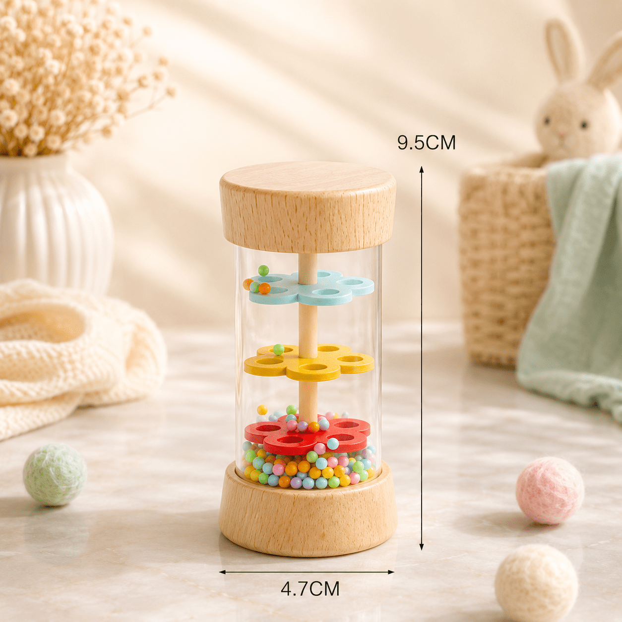 A wooden and clear glass baby sensory toy with dimensions